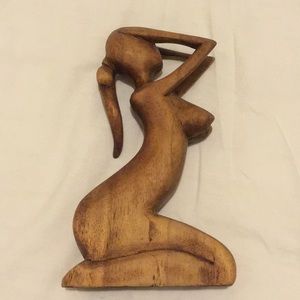 Wooden statue of nude woman